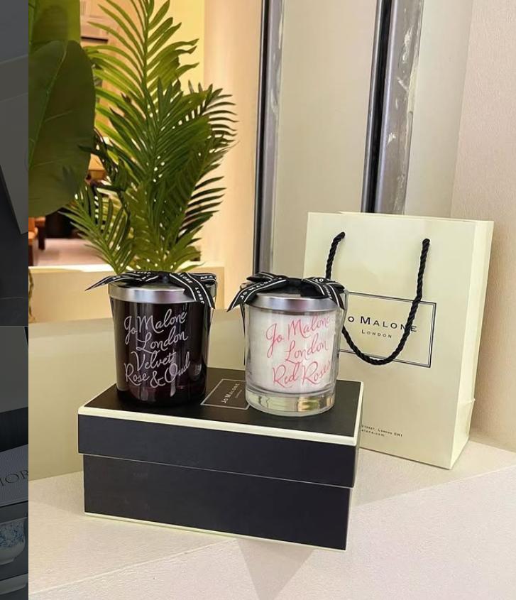 Jo Malone London Velvet Rose & Oud scented candle in a limited edition black glass container